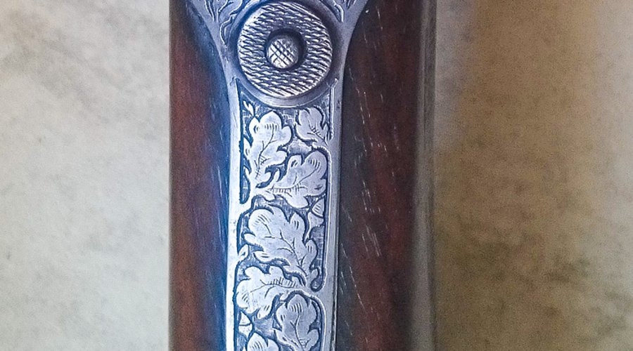 Knopfabzugsgewehr: eine spezielle Bockdoppelflinte für die Jagd Knopf zum Auslösen der Läufe am Knopfabzugsgewehr von E.R. Martin