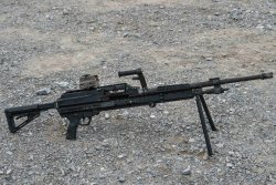 SIG Sauer SLMAG equipped with a red-dot reflex sight.