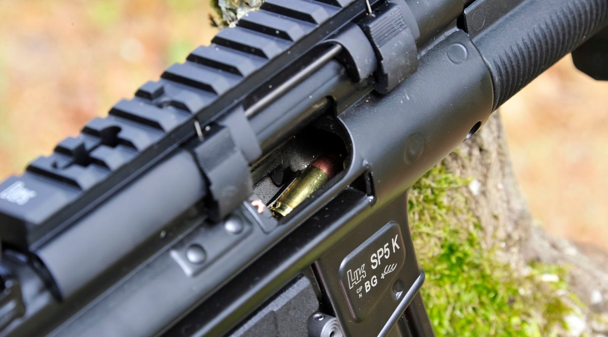 Claw-mount Picatinny optics rail mounted on a Heckler & Koch SP5K pistol