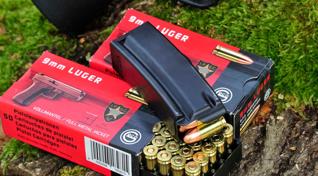 15-rounds magazine of a Heckler & Koch SP5K pistol on GECO ammunition boxes