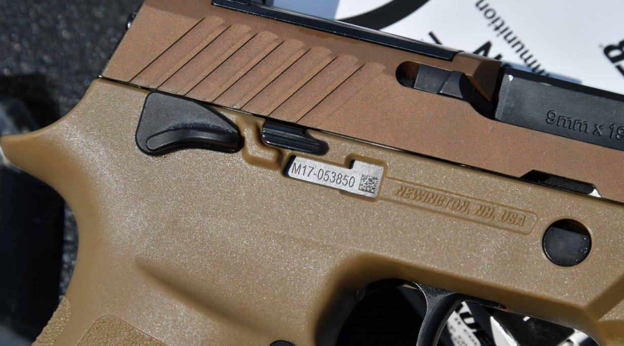 Detail of the serial number window on the grip of SIG Sauer P320 M17