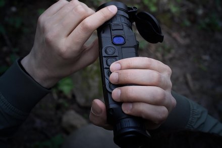 Pulsar Helion 2 XP50 thermal monocular Man holding the Pulsar Helion 2 XP50 thermal monocular