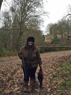 Lady Hunter - Clay shooting and deer stalking Jade Cruickshank in a game shooting day holding a pheasant