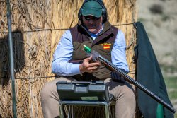 Dream Hunt: shooting high-flying driven partridge in Spain Loader ejecting shotgun cartridges on shoot
