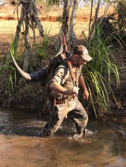 Dream hunt: Hunting in Australia Shaun hiking back with a 103 inch buffalo bull