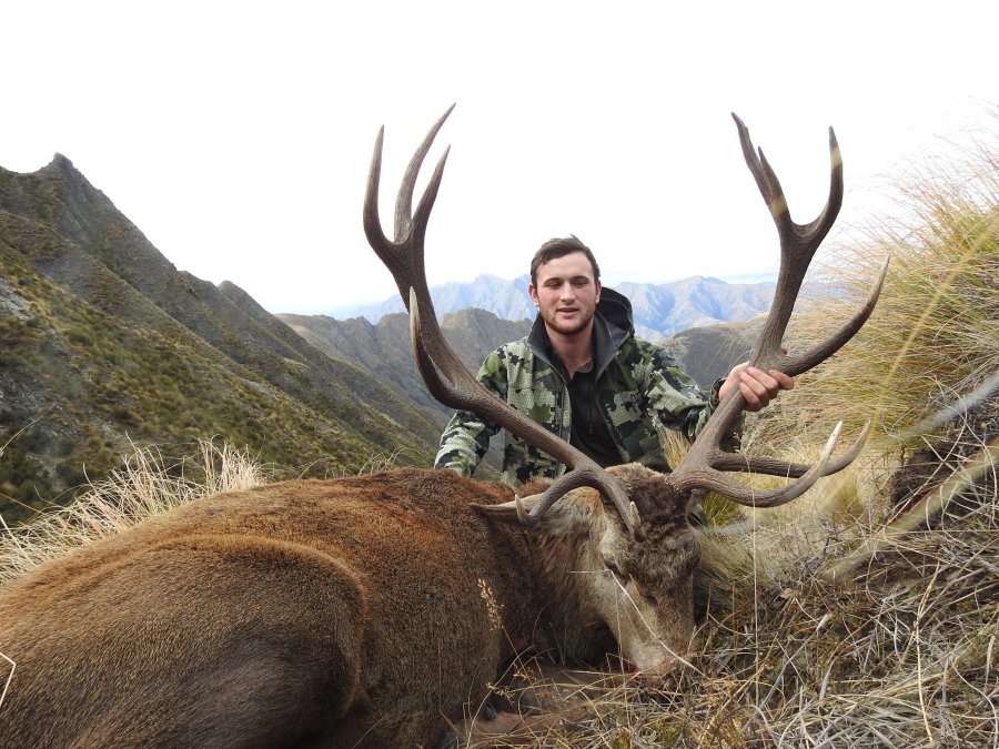 Hunting in NZ, South Island Hunter Warren Broad with a stag