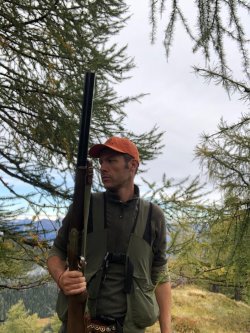 Hunting birds in the high altitude Italian Alps Luca Benzi hunting with his Beretta shotgun in Italian Alps