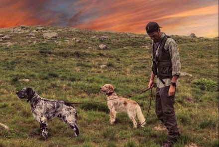 Hunting birds in the high altitude Italian Alps Luca Benzi with his two working dogs English setters