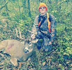 Tyler Brenner aged 8 with his first white tailed buck. Hunter with a 151 inch buck