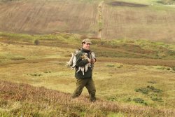 Ferreting for rabbits in Scotland Christian Korsten carrying rabbits during the hunting with ferret
