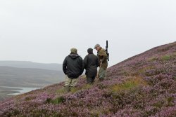 Preparation for shooting and hunting in the UK Deer stalkers in the mountain