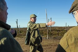 Preparation for shooting and hunting in the UK A gamekeeper with clients on driven grouse day