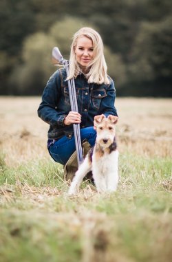 Lady hunter and clay shooter Rachel Carrie Lady hunter Rachel Carrie with her Fox Terrier