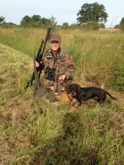 Deer officer and Stalker Audrey Watson Deer stalker Audrey Watson with a roe buck and her teckel.