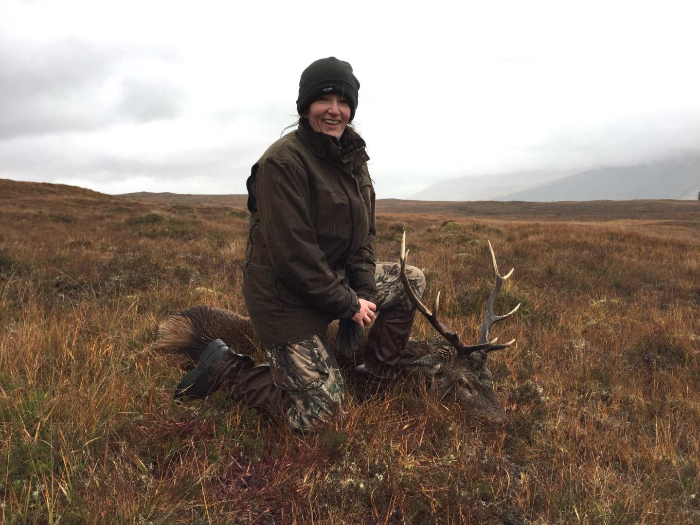 Lady hunter and a red stag