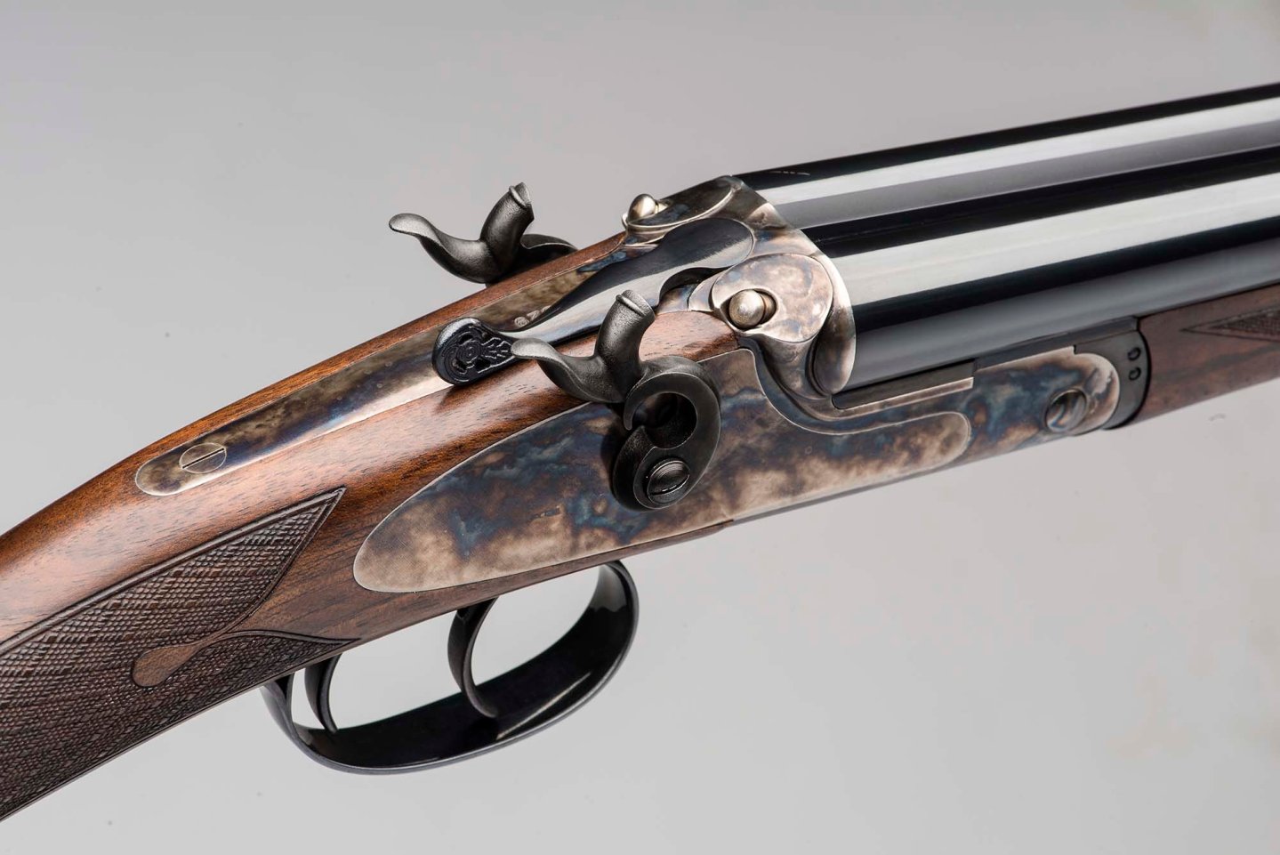 F.A.I.R. Iside Vintage 20-gauge shotgun: a classic external hammer shotgun in a modern version The elegant color case hardened receiver of the 20-ga F.A.I.R Iside Vintage shotgun