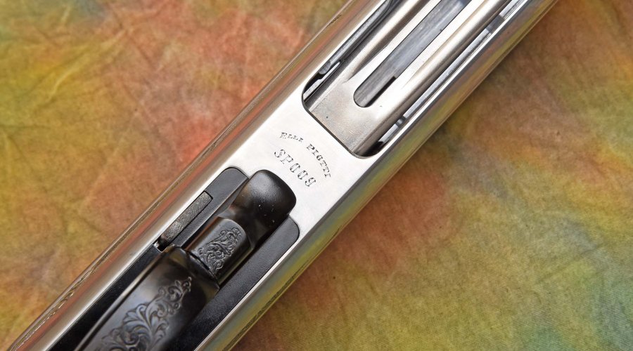 The Piotti name and serial number on the semi-automatic shotgun
