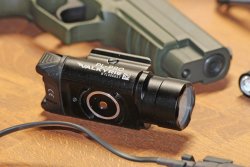 Olight PL-PRO Valkyrie, a powerful and inexpensive gun flashlight The magnetic charging port of the Olight PL-PRO Valkyrie flashlight