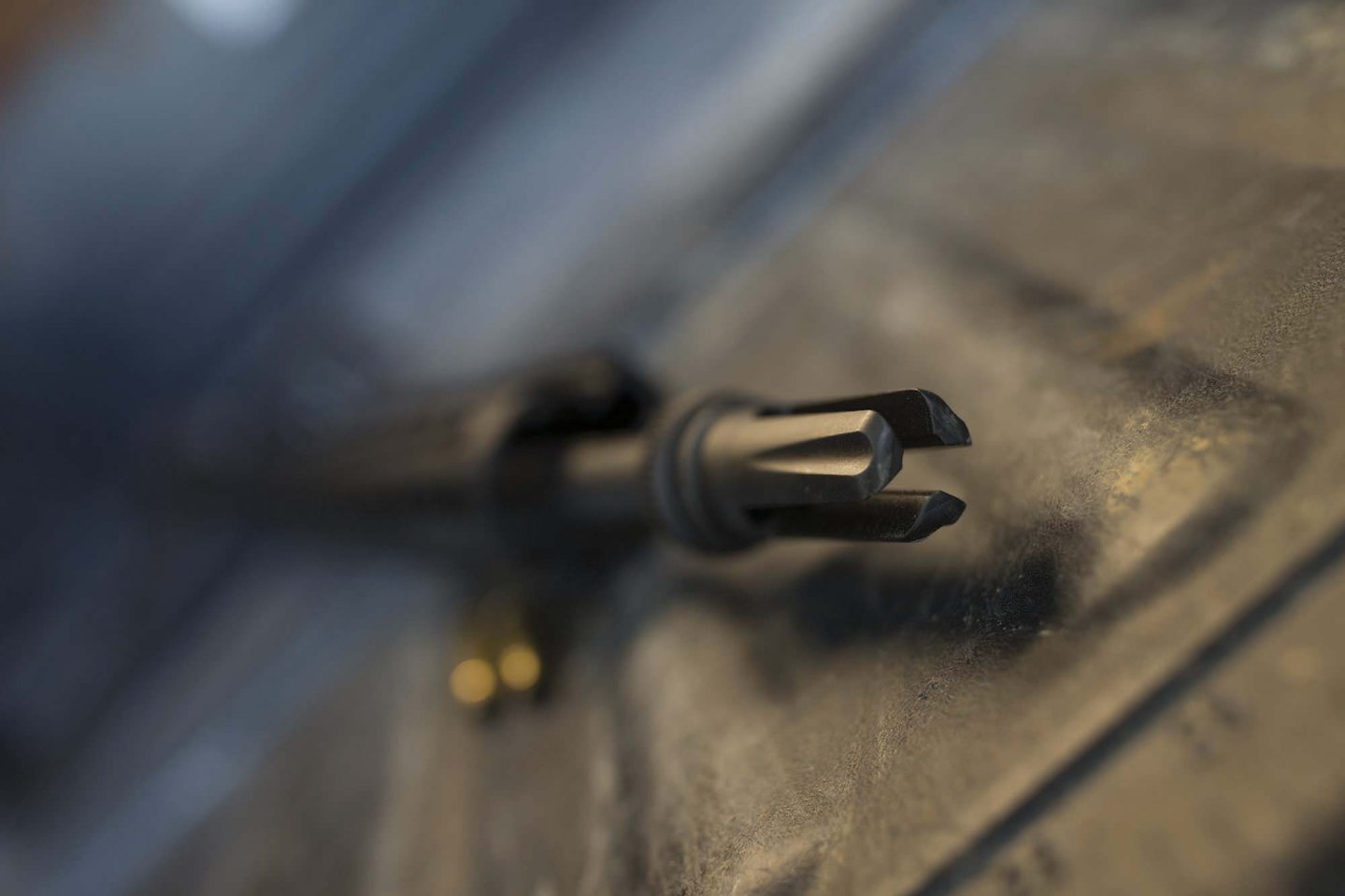 AAC muzzle brakes and flash hiders The three-prong AAC flash hider mounted on a "black rifle"