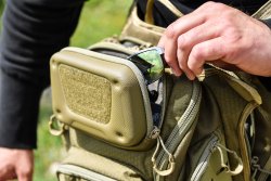 Maxpedition Wolfspur shoulder bag EVA polymer pouch on top of the Wolfspur bag