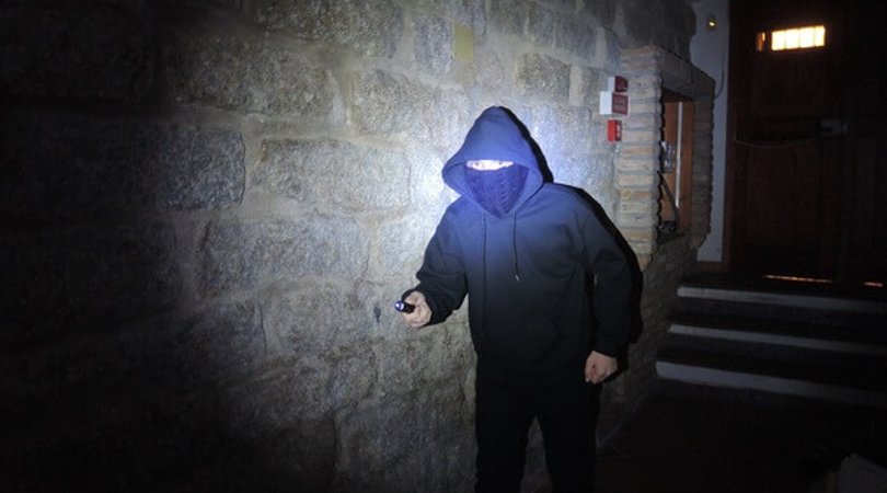 Intruder illuminated by the white light LED of an MFT Torch Backup tactical gunlight