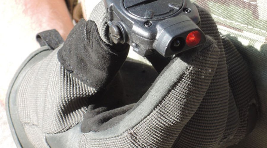 MFT Torch Backup tactical gunlight held by gloved hand