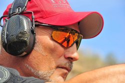 The Tactical Corner - Firearms and hearing Shooter with earmuffs