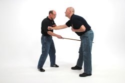 Self-defense and unarmed defense part 9 - Advanced stick techniques Hit the aggressor in the abdomen with the stick.