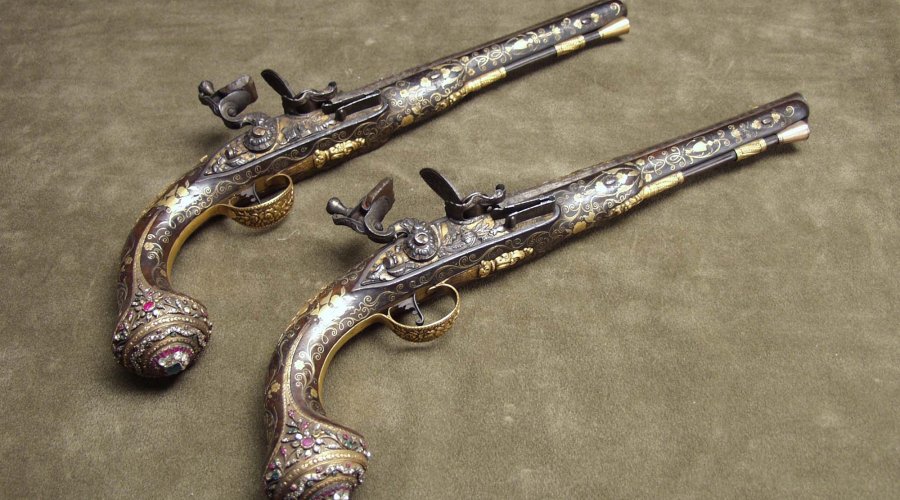 A pair of English Wilson flintlock pistols