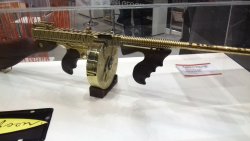 IWA 2018: the Good, the Bad and the Ugly A gold-plated Thompson submachine gun - or Tommy Gun at IWA 2018