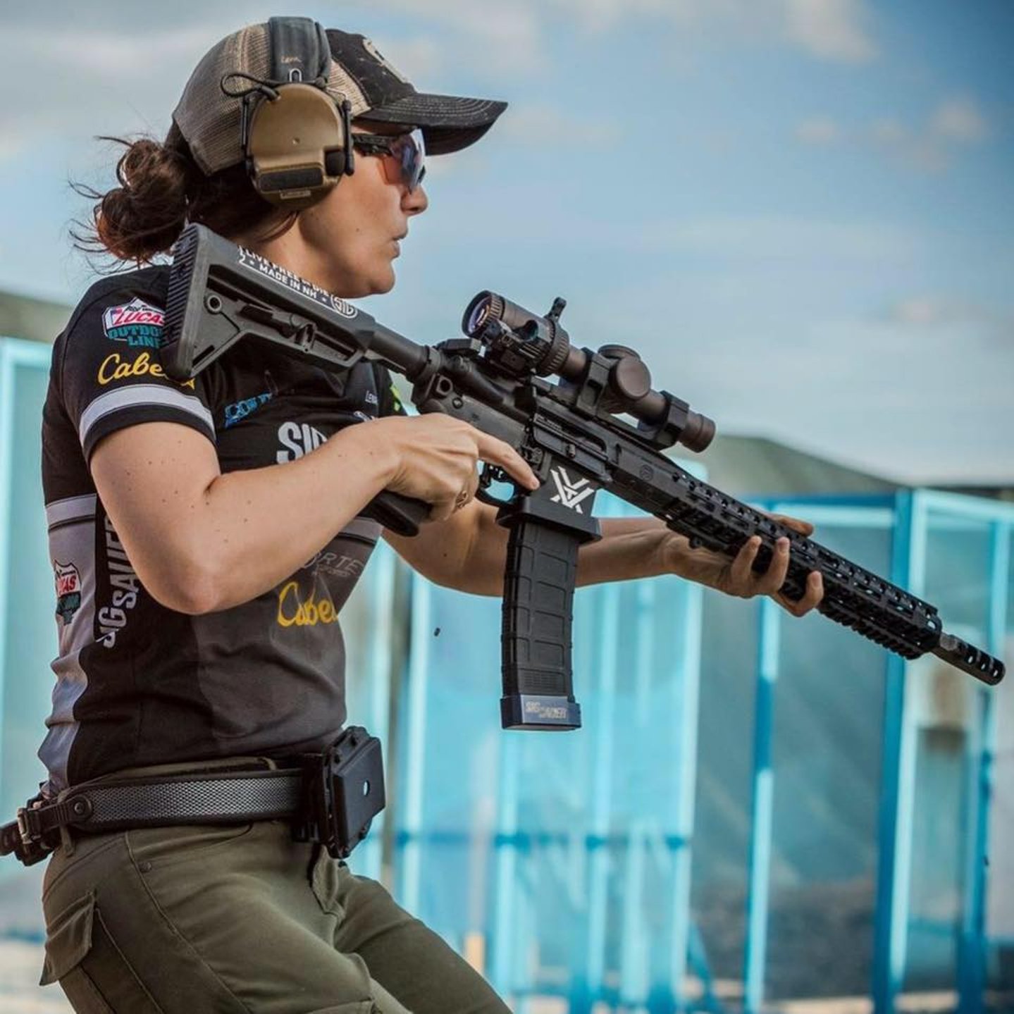 Lena Miculek (Team SIG) holding the SIG M400 Predator rifle.