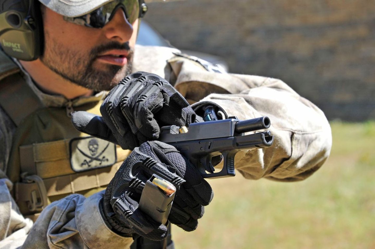 The Tactical Corner – The “round in chamber” dilemma Racking the pistol slide