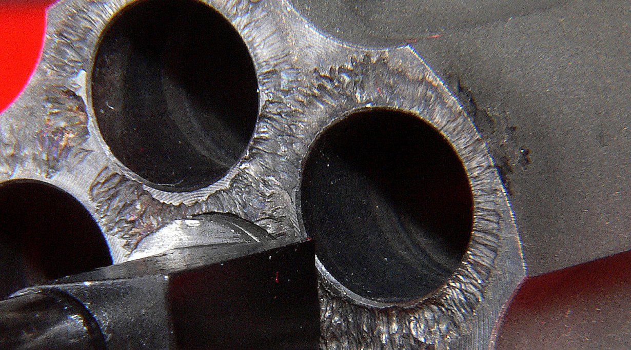 Titanium cylinder erosion in revolvers 