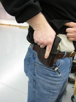 The Shooter’s Talk – The spirit of gun laws Man drawing of the gun from the holster