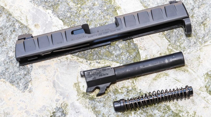 The separate slide, barrel and recoil spring of the Beretta APX