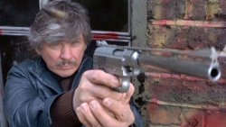 Big guns: the Wildey strikes back Charles Bronson in Death Wish 3 with the Wildey semi-auto pistol