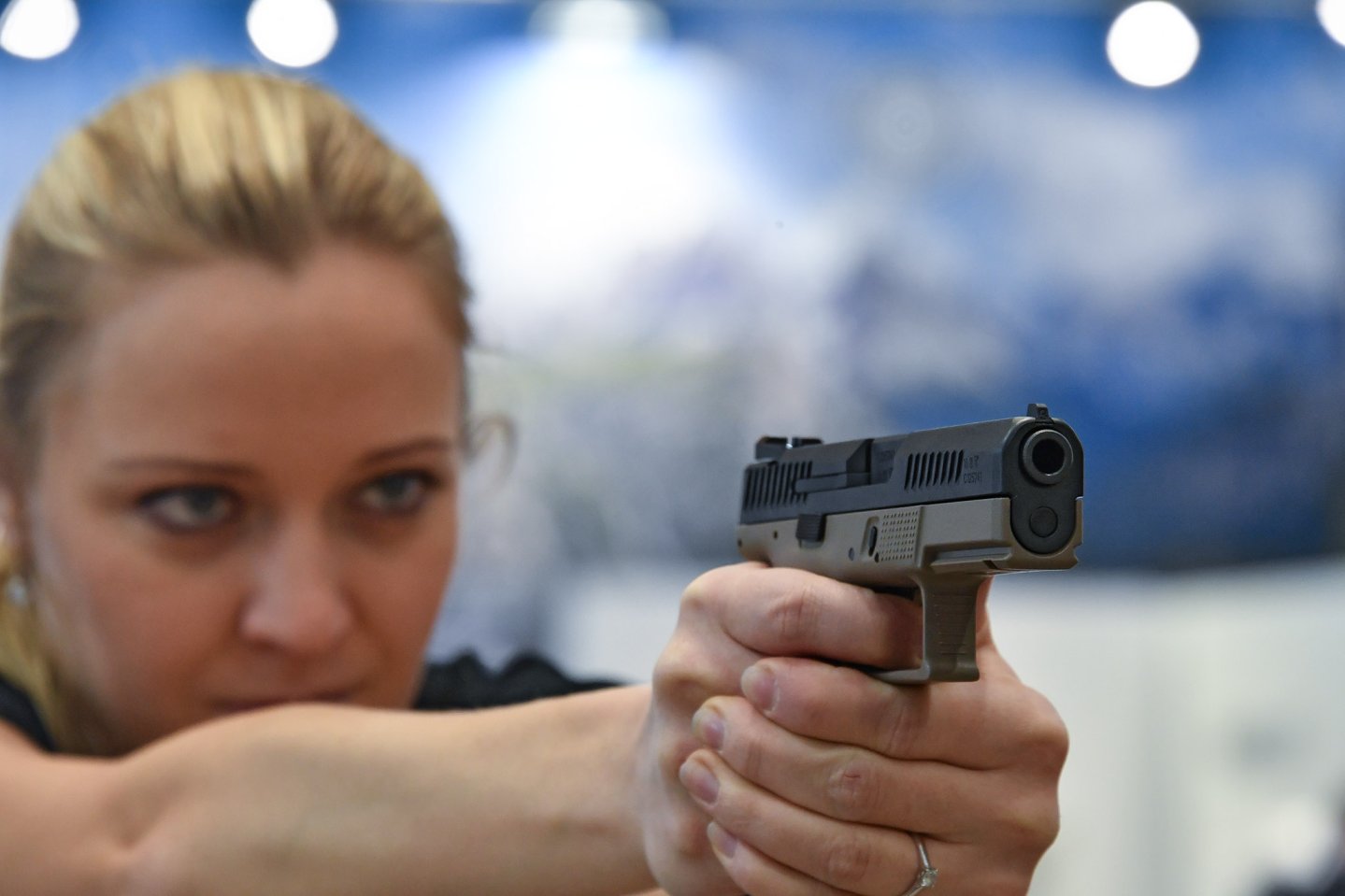 New CZ P-10 C striker fired pistol Women shooting with CZ P-10