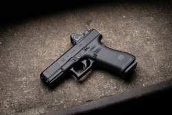 Glock G45 M.O.S. in 9 mm Luger GLOCK G45 MOS with Trijicon optics mounted.