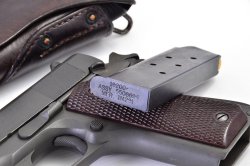 100,000 Army surplus 1911s pistols soon for sale? Colt Government M 1911: case and magazine