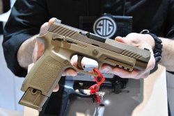 SIG Sauer P320-M17, a soldier in civilian clothes SIG Sauer P320-M17, a soldier in civilian clothes