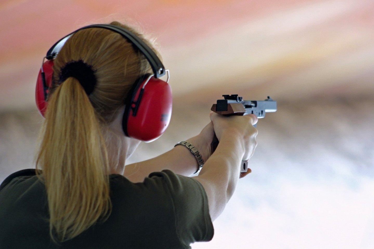 Shooter with Walther GSP in two-handed position