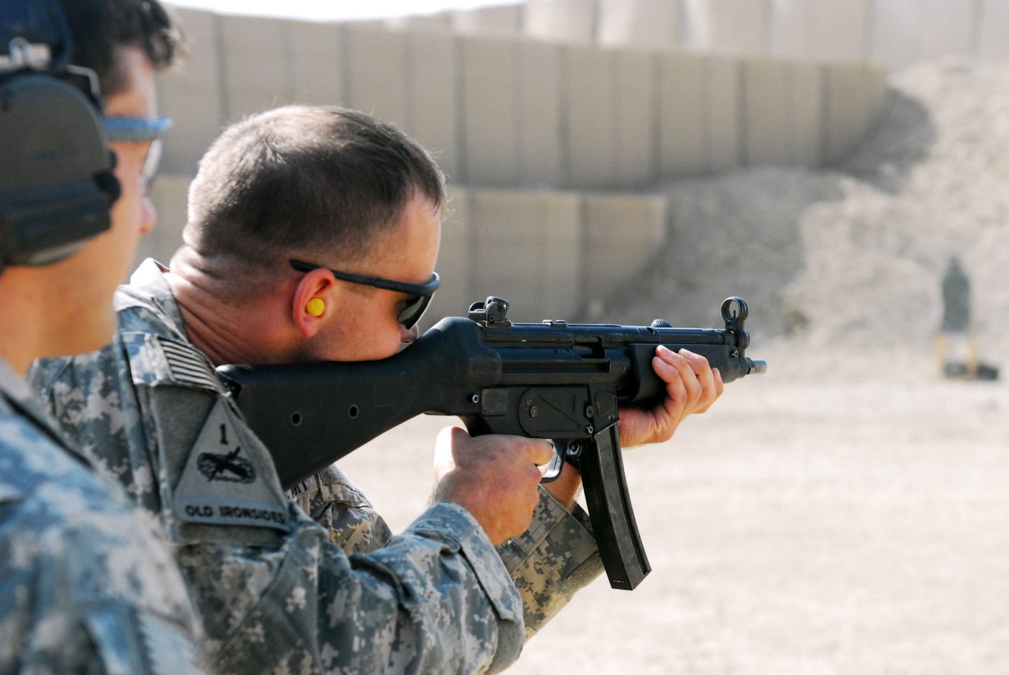 Soldier shooting with the Heckler and Koch MP5s