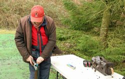Clay Shooting: with Iain MacGregor and Linda Mellor Shotgun Coach Iain MacGregor getting ready to shoot at pattern plate.