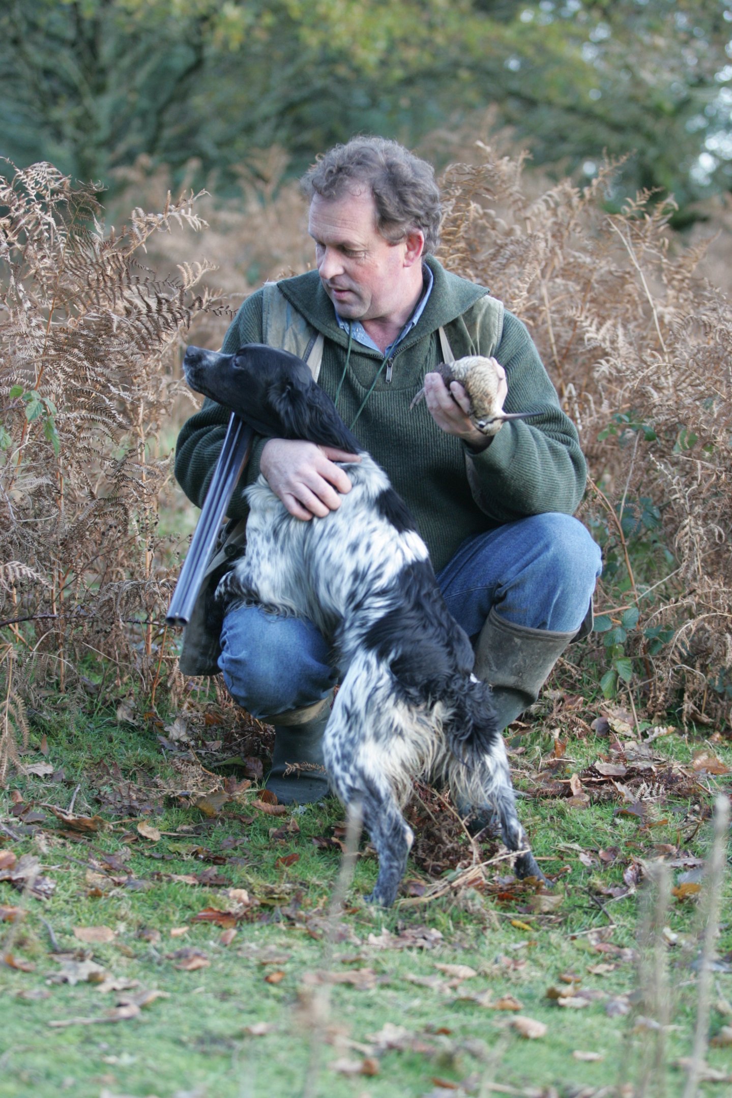 Cacciatore con fucile, cane e beccaccia